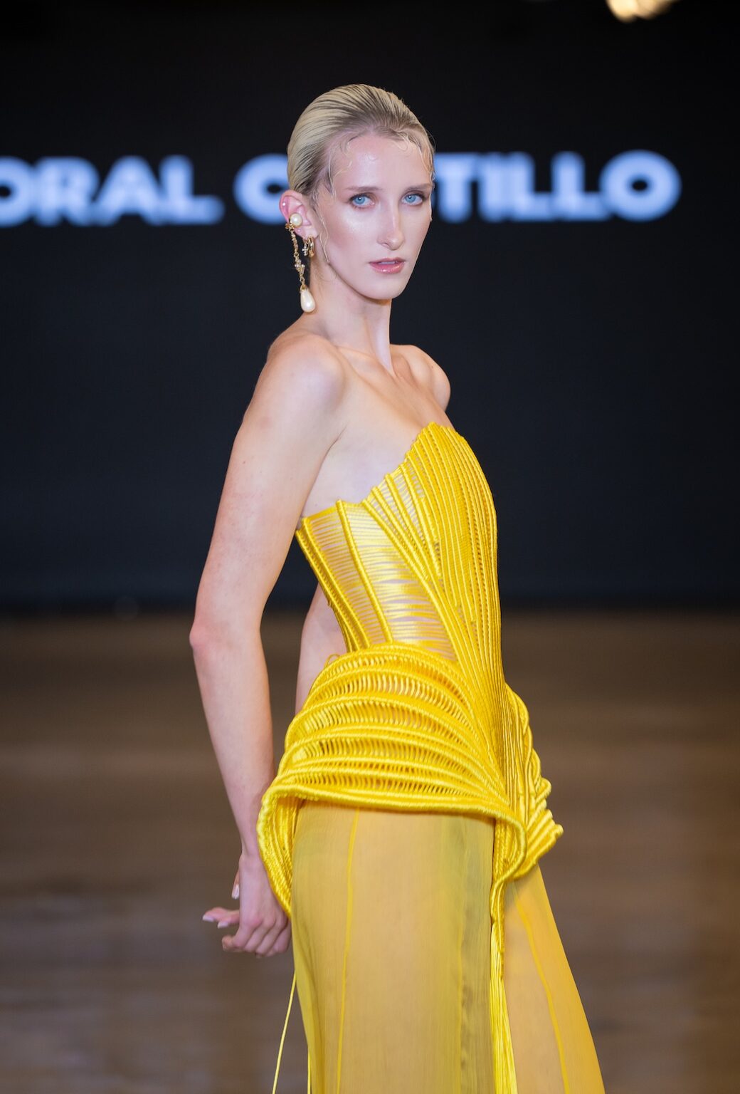 LOS ANGELES, CALIFORNIA - OCTOBER 16: A model walks the runway at the Coral Castillo show during Los Angeles Fashion Week Powered By Art Hearts Fashion at The New Mart on October 16, 2025 in Los Angeles, California. (Photo by Mark Gunter/Getty Images for Art Hearts Fashion)