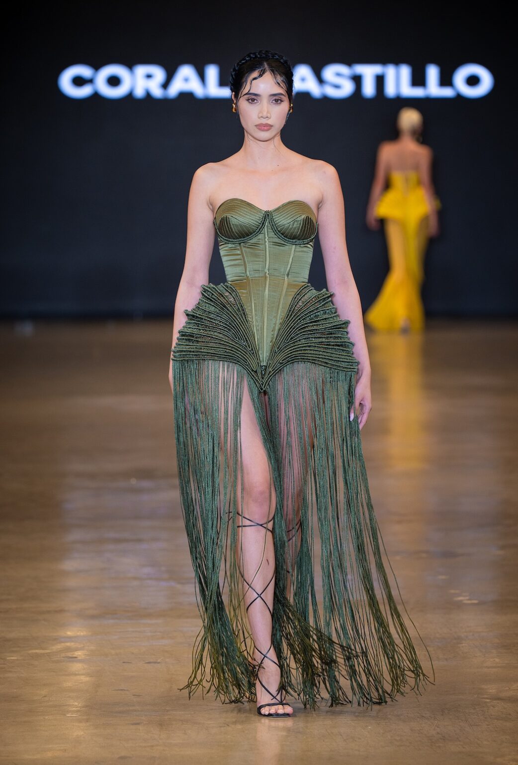 LOS ANGELES, CALIFORNIA - OCTOBER 16: A model walks the runway at the Coral Castillo show during Los Angeles Fashion Week Powered By Art Hearts Fashion at The New Mart on October 16, 2025 in Los Angeles, California. (Photo by Mark Gunter/Getty Images for Art Hearts Fashion)
