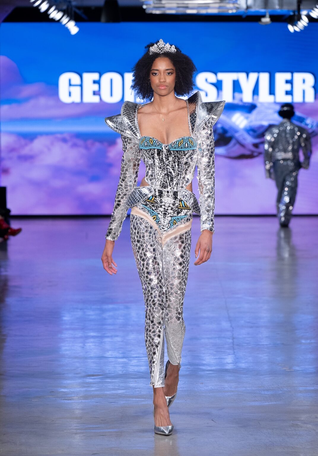 LOS ANGELES, CALIFORNIA - OCTOBER 17: A model walks the runway at the George Styler show during Los Angeles Fashion Week Powered By Art Hearts Fashion at The New Mart on October 17, 2025 in Los Angeles, California. (Photo by Mark Gunter/Getty Images for Art Hearts Fashion)