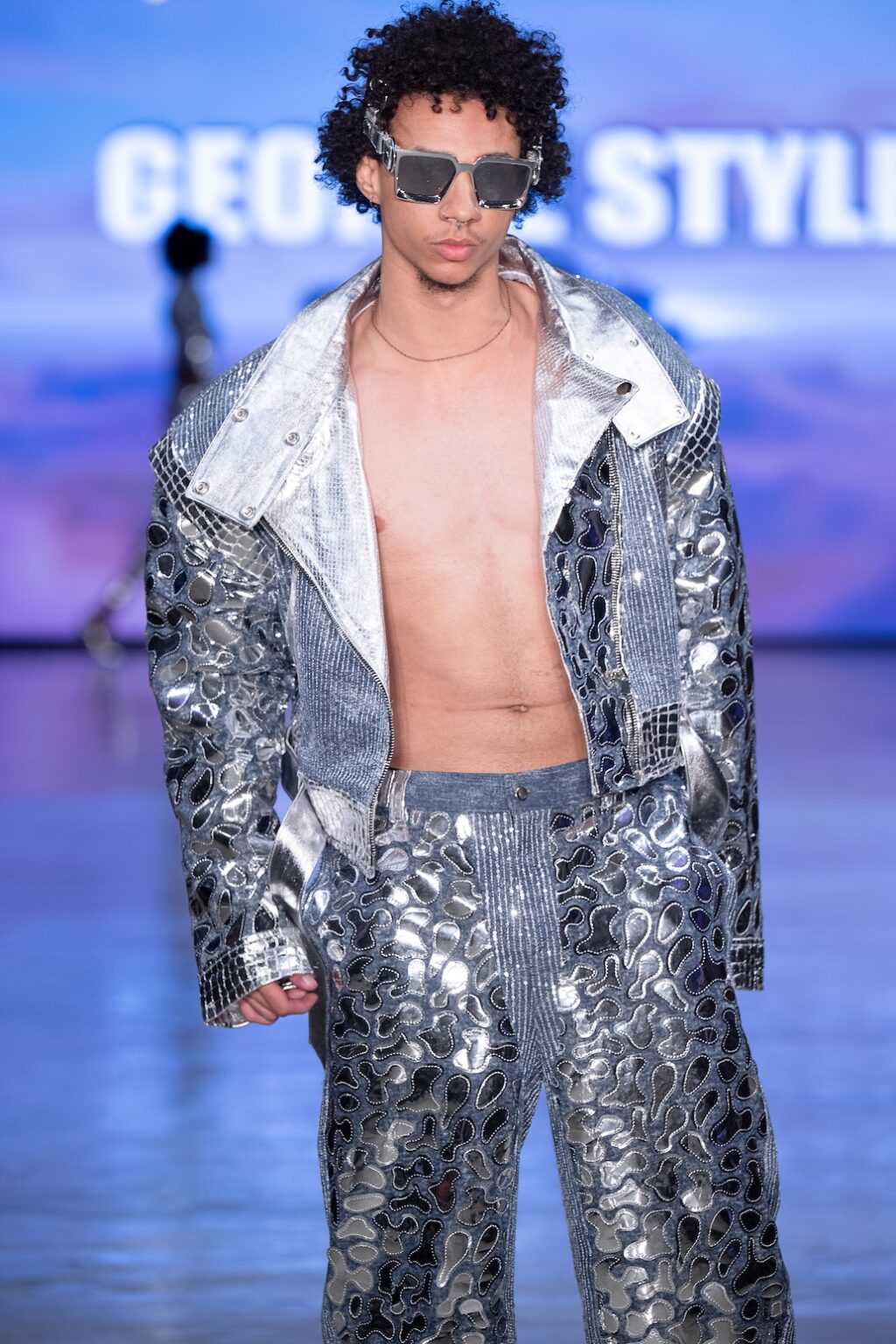 LOS ANGELES, CALIFORNIA - OCTOBER 17: A model walks the runway at the George Styler show during Los Angeles Fashion Week Powered By Art Hearts Fashion at The New Mart on October 17, 2025 in Los Angeles, California. (Photo by Mark Gunter/Getty Images for Art Hearts Fashion)