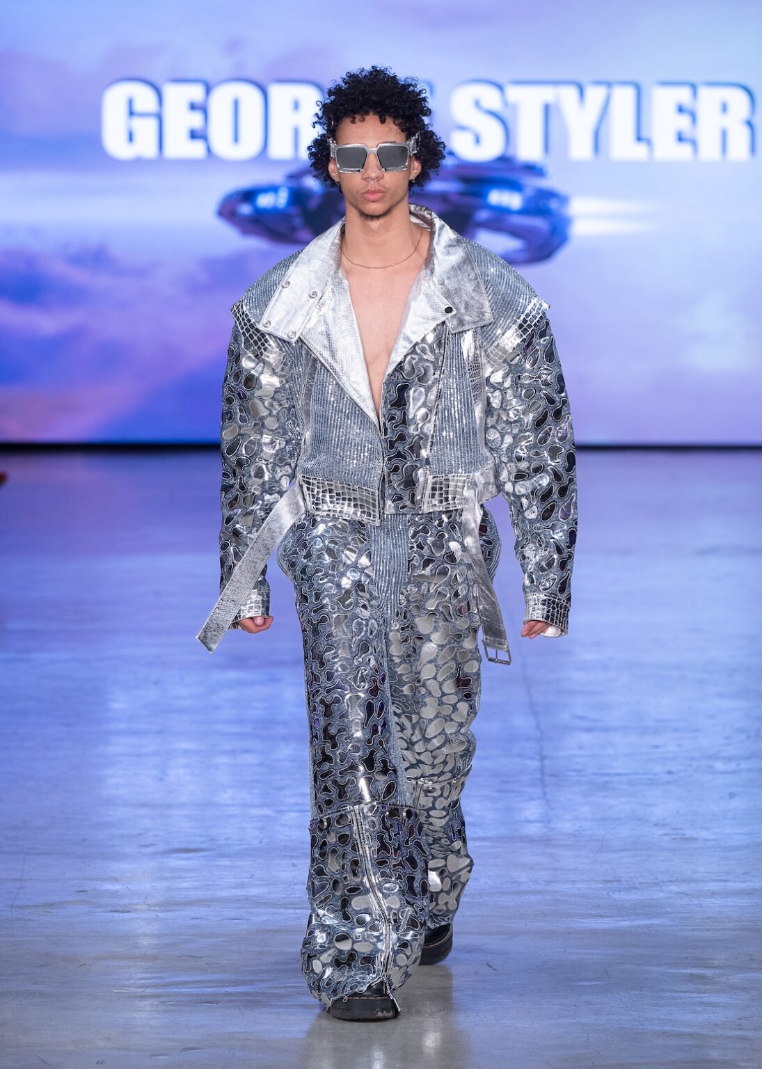 LOS ANGELES, CALIFORNIA - OCTOBER 17: A model walks the runway at the George Styler show during Los Angeles Fashion Week Powered By Art Hearts Fashion at The New Mart on October 17, 2025 in Los Angeles, California. (Photo by Mark Gunter/Getty Images for Art Hearts Fashion)