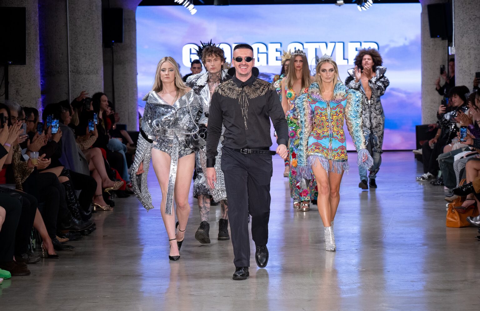 LOS ANGELES, CALIFORNIA - OCTOBER 17: Designer George Styler and models walk the runway at the George Styler show during Los Angeles Fashion Week Powered By Art Hearts Fashion at The New Mart on October 17, 2025 in Los Angeles, California. (Photo by Mark Gunter/Getty Images for Art Hearts Fashion)