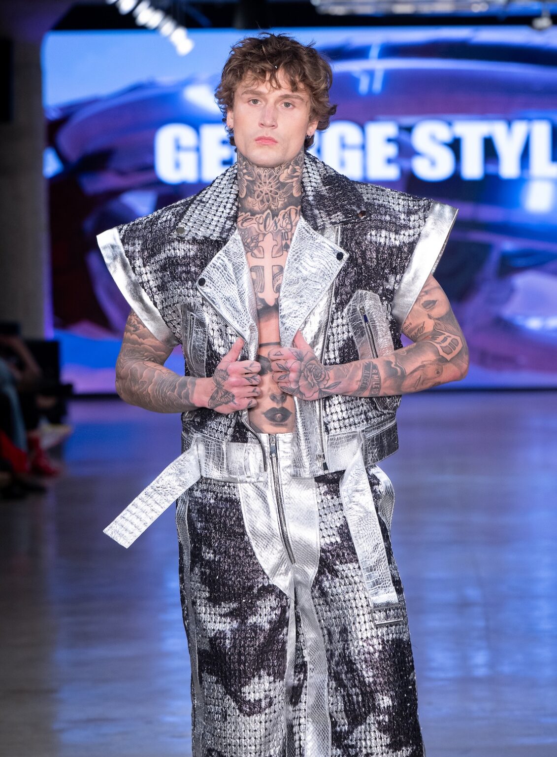 LOS ANGELES, CALIFORNIA - OCTOBER 17: A model walks the runway at the George Styler show during Los Angeles Fashion Week Powered By Art Hearts Fashion at The New Mart on October 17, 2025 in Los Angeles, California. (Photo by Mark Gunter/Getty Images for Art Hearts Fashion)