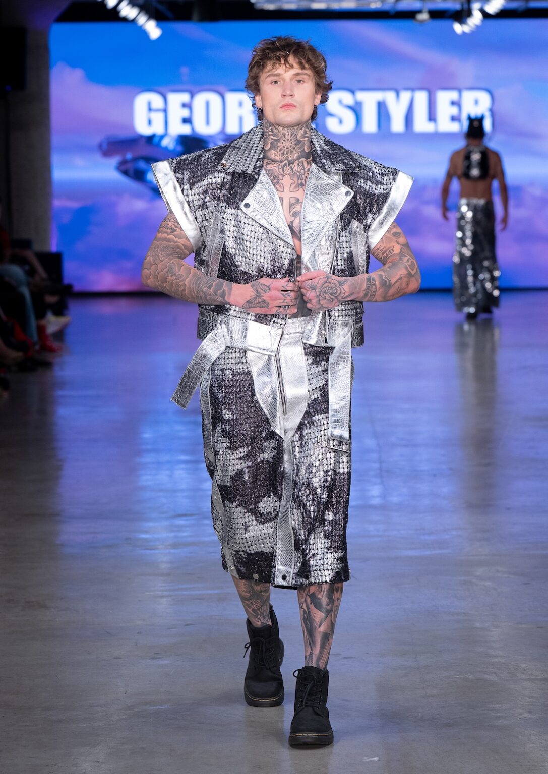 LOS ANGELES, CALIFORNIA - OCTOBER 17: A model walks the runway at the George Styler show during Los Angeles Fashion Week Powered By Art Hearts Fashion at The New Mart on October 17, 2025 in Los Angeles, California. (Photo by Mark Gunter/Getty Images for Art Hearts Fashion)