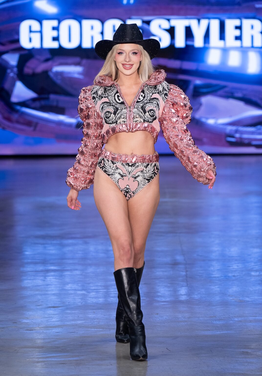 LOS ANGELES, CALIFORNIA - OCTOBER 17: A model walks the runway at the George Styler show during Los Angeles Fashion Week Powered By Art Hearts Fashion at The New Mart on October 17, 2025 in Los Angeles, California. (Photo by Mark Gunter/Getty Images for Art Hearts Fashion)
