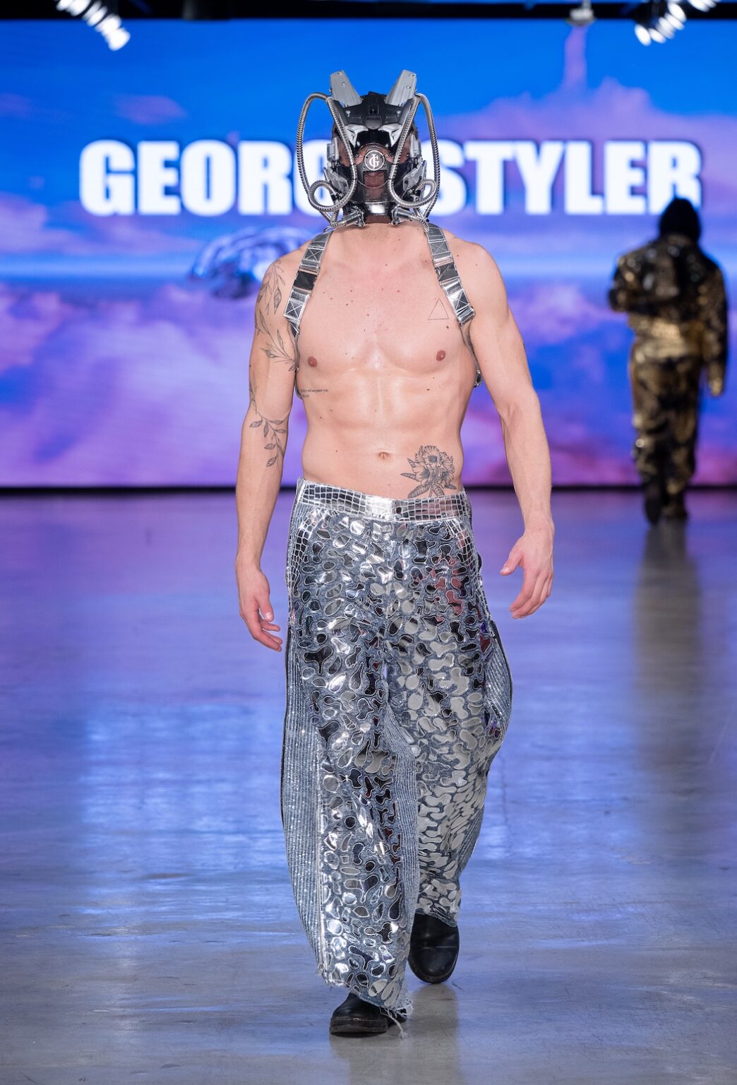 LOS ANGELES, CALIFORNIA - OCTOBER 17: A model walks the runway at the George Styler show during Los Angeles Fashion Week Powered By Art Hearts Fashion at The New Mart on October 17, 2025 in Los Angeles, California. (Photo by Mark Gunter/Getty Images for Art Hearts Fashion)