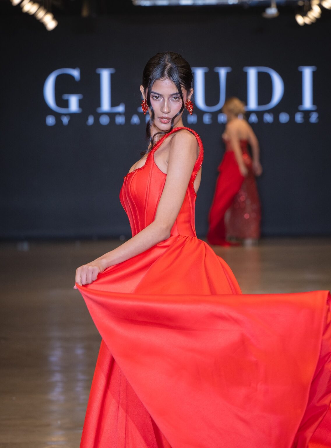 LOS ANGELES, CALIFORNIA - OCTOBER 16: A model walks the runway at the Glaudi show during Los Angeles Fashion Week Powered By Art Hearts Fashion at The New Mart on October 16, 2025 in Los Angeles, California. (Photo by Mark Gunter/Getty Images for Art Hearts Fashion)