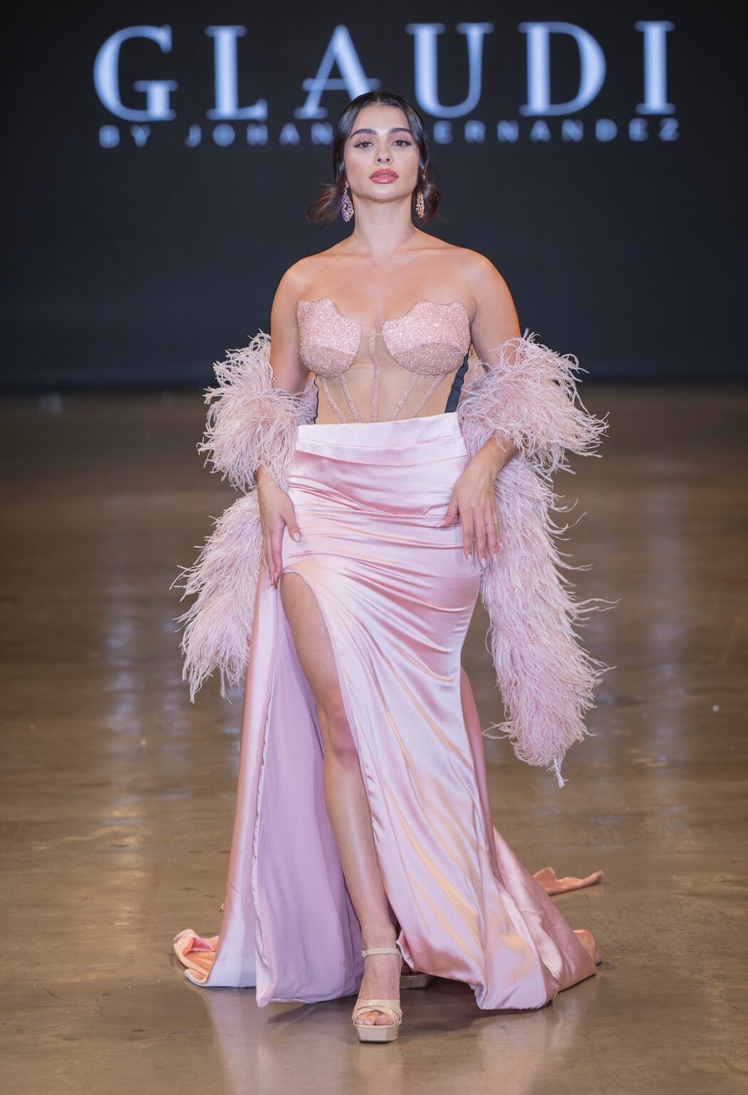 LOS ANGELES, CALIFORNIA - OCTOBER 16: A model walks the runway at the Glaudi show during Los Angeles Fashion Week Powered By Art Hearts Fashion at The New Mart on October 16, 2025 in Los Angeles, California. (Photo by Mark Gunter/Getty Images for Art Hearts Fashion)