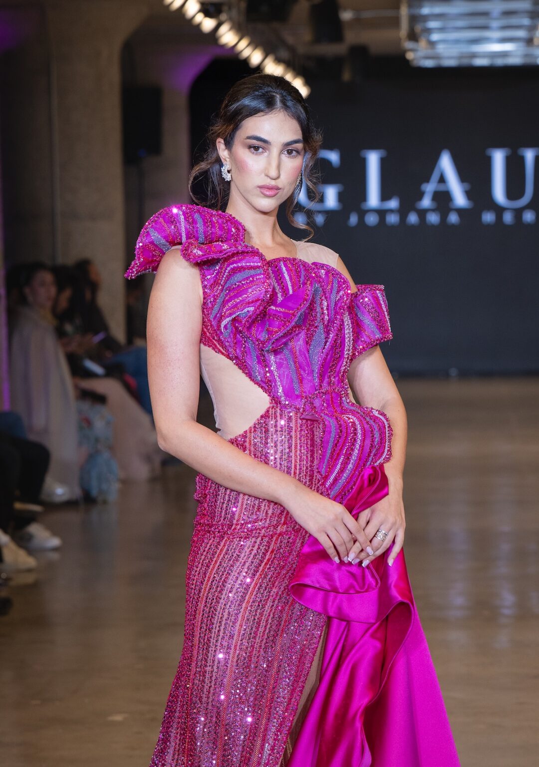 LOS ANGELES, CALIFORNIA - OCTOBER 16: A model walks the runway at the Glaudi show during Los Angeles Fashion Week Powered By Art Hearts Fashion at The New Mart on October 16, 2025 in Los Angeles, California. (Photo by Mark Gunter/Getty Images for Art Hearts Fashion)