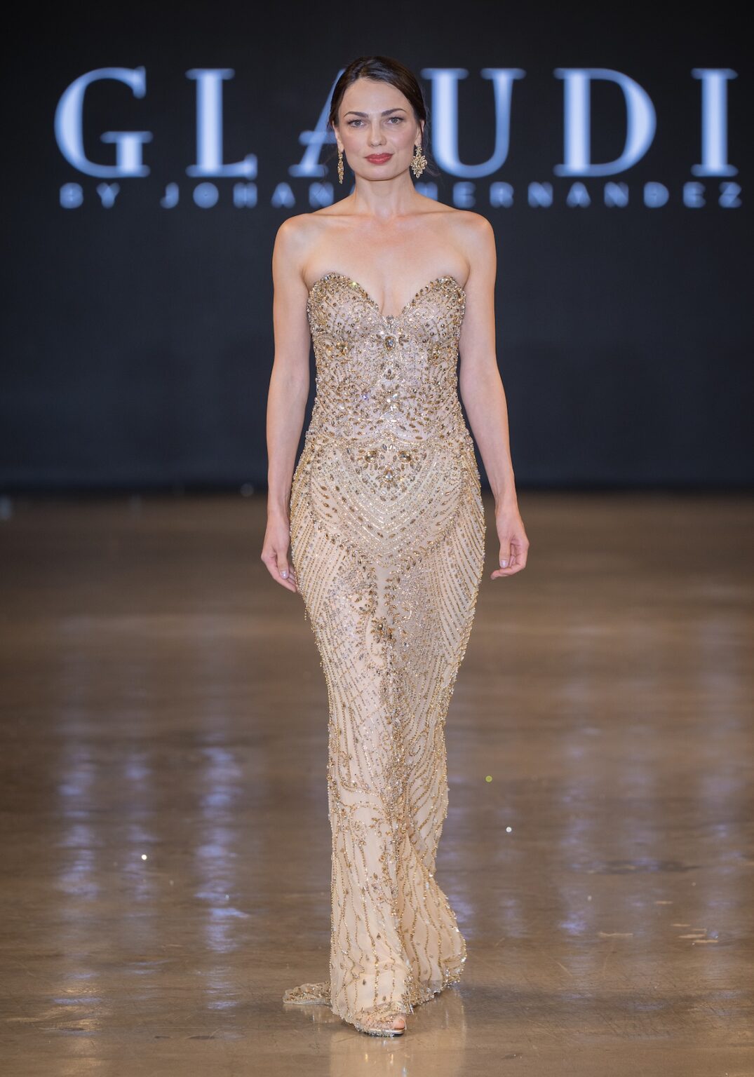 LOS ANGELES, CALIFORNIA - OCTOBER 16: A model walks the runway at the Glaudi show during Los Angeles Fashion Week Powered By Art Hearts Fashion at The New Mart on October 16, 2025 in Los Angeles, California. (Photo by Mark Gunter/Getty Images for Art Hearts Fashion)