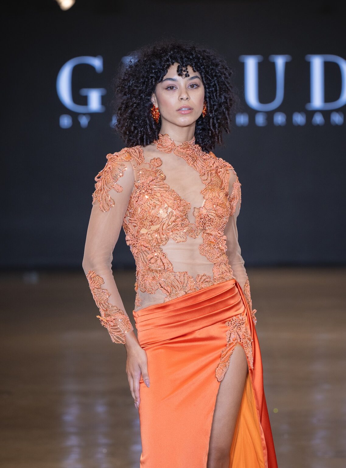 LOS ANGELES, CALIFORNIA - OCTOBER 16: A model walks the runway at the Glaudi show during Los Angeles Fashion Week Powered By Art Hearts Fashion at The New Mart on October 16, 2025 in Los Angeles, California. (Photo by Mark Gunter/Getty Images for Art Hearts Fashion)