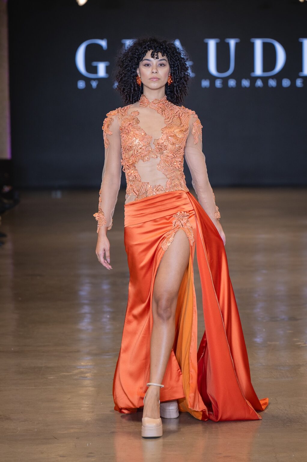 LOS ANGELES, CALIFORNIA - OCTOBER 16: A model walks the runway at the Glaudi show during Los Angeles Fashion Week Powered By Art Hearts Fashion at The New Mart on October 16, 2025 in Los Angeles, California. (Photo by Mark Gunter/Getty Images for Art Hearts Fashion)