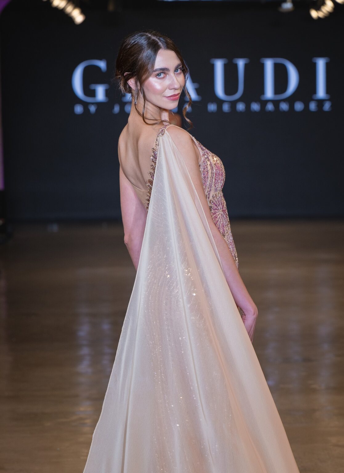 LOS ANGELES, CALIFORNIA - OCTOBER 16: A model walks the runway at the Glaudi show during Los Angeles Fashion Week Powered By Art Hearts Fashion at The New Mart on October 16, 2025 in Los Angeles, California. (Photo by Mark Gunter/Getty Images for Art Hearts Fashion)