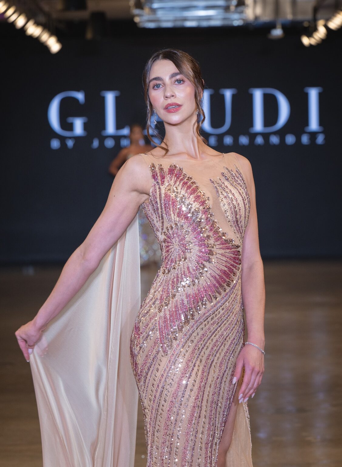 LOS ANGELES, CALIFORNIA - OCTOBER 16: A model walks the runway at the Glaudi show during Los Angeles Fashion Week Powered By Art Hearts Fashion at The New Mart on October 16, 2025 in Los Angeles, California. (Photo by Mark Gunter/Getty Images for Art Hearts Fashion)