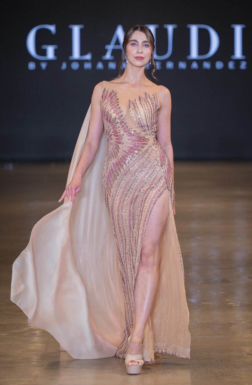 LOS ANGELES, CALIFORNIA - OCTOBER 16: A model walks the runway at the Glaudi show during Los Angeles Fashion Week Powered By Art Hearts Fashion at The New Mart on October 16, 2025 in Los Angeles, California. (Photo by Mark Gunter/Getty Images for Art Hearts Fashion)