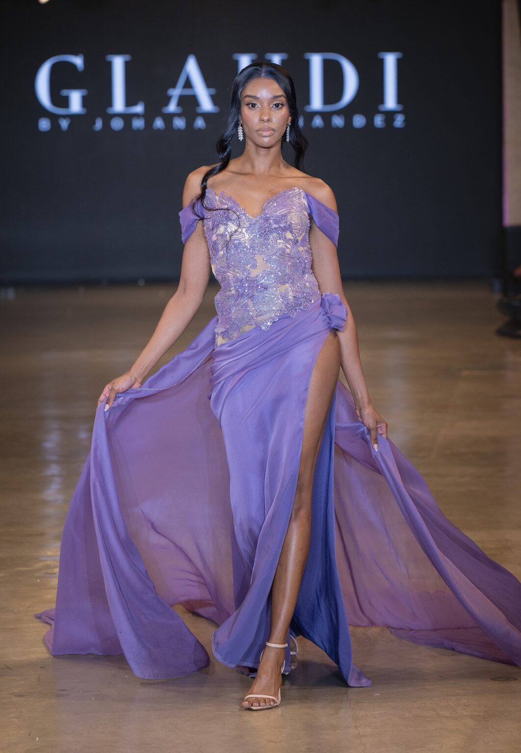 LOS ANGELES, CALIFORNIA - OCTOBER 16: A model walks the runway at the Glaudi show during Los Angeles Fashion Week Powered By Art Hearts Fashion at The New Mart on October 16, 2025 in Los Angeles, California. (Photo by Mark Gunter/Getty Images for Art Hearts Fashion)