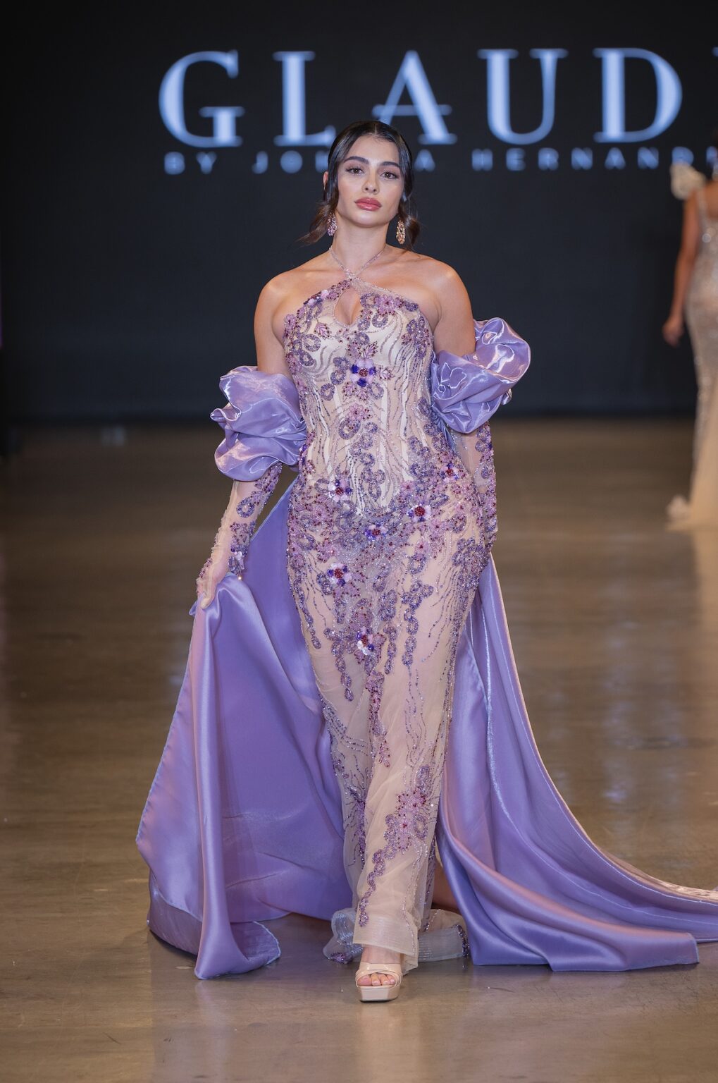 LOS ANGELES, CALIFORNIA - OCTOBER 16: A model walks the runway at the Glaudi show during Los Angeles Fashion Week Powered By Art Hearts Fashion at The New Mart on October 16, 2025 in Los Angeles, California. (Photo by Mark Gunter/Getty Images for Art Hearts Fashion)