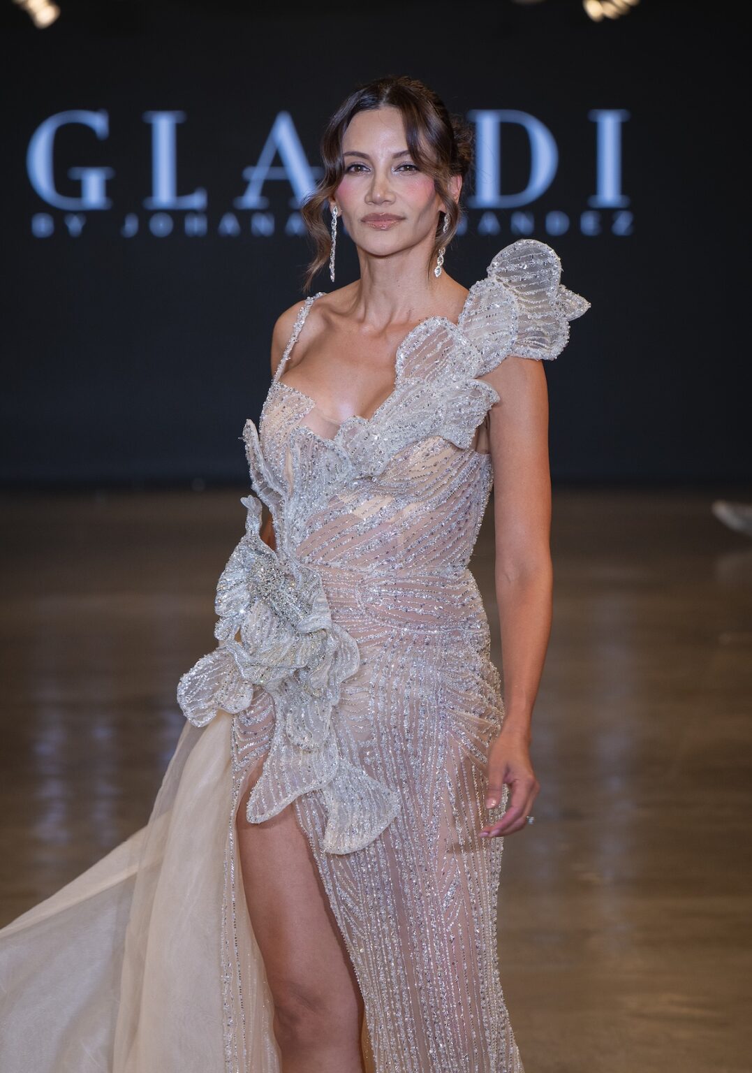 LOS ANGELES, CALIFORNIA - OCTOBER 16: A model walks the runway at the Glaudi show during Los Angeles Fashion Week Powered By Art Hearts Fashion at The New Mart on October 16, 2025 in Los Angeles, California. (Photo by Mark Gunter/Getty Images for Art Hearts Fashion)