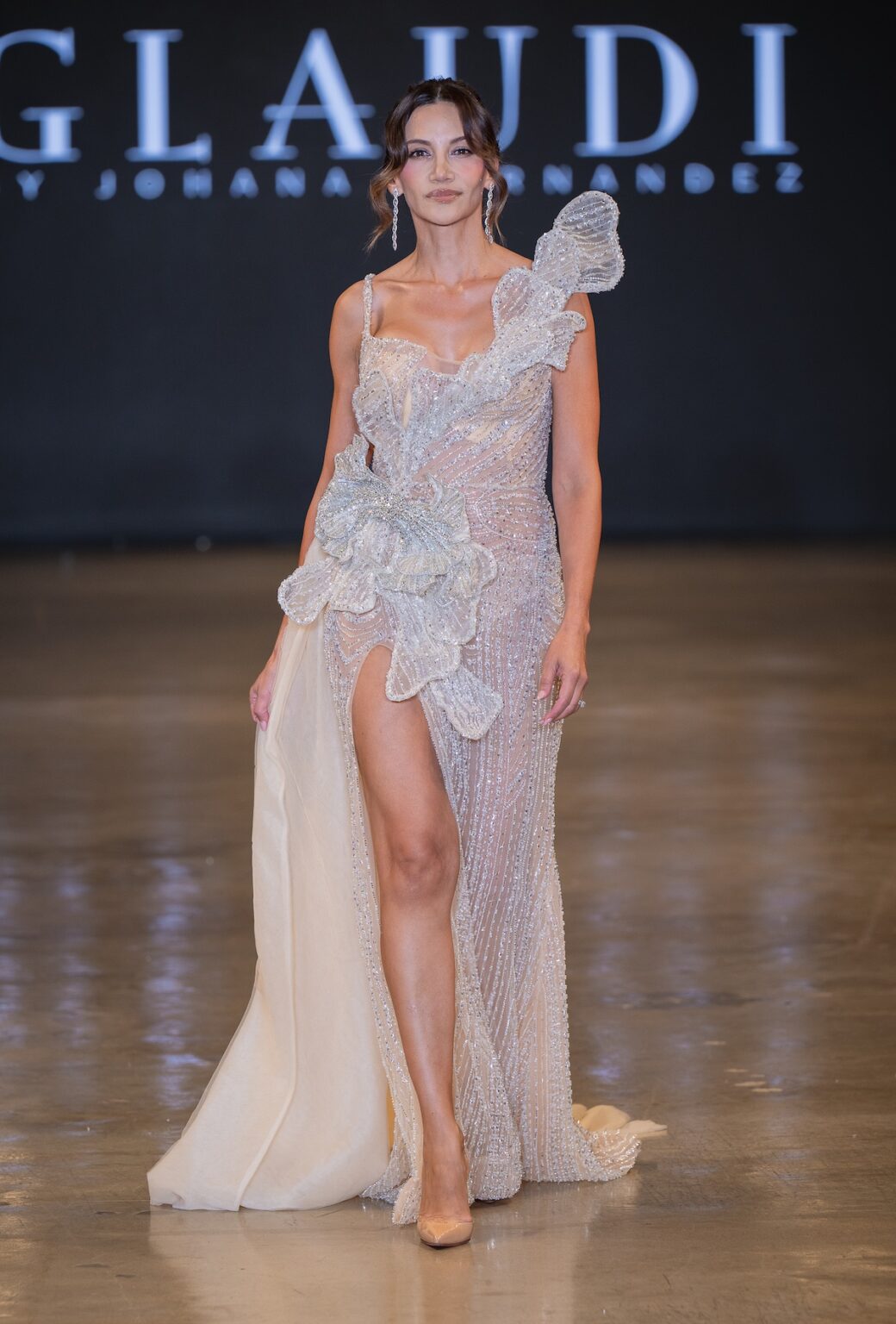 LOS ANGELES, CALIFORNIA - OCTOBER 16: A model walks the runway at the Glaudi show during Los Angeles Fashion Week Powered By Art Hearts Fashion at The New Mart on October 16, 2025 in Los Angeles, California. (Photo by Mark Gunter/Getty Images for Art Hearts Fashion)