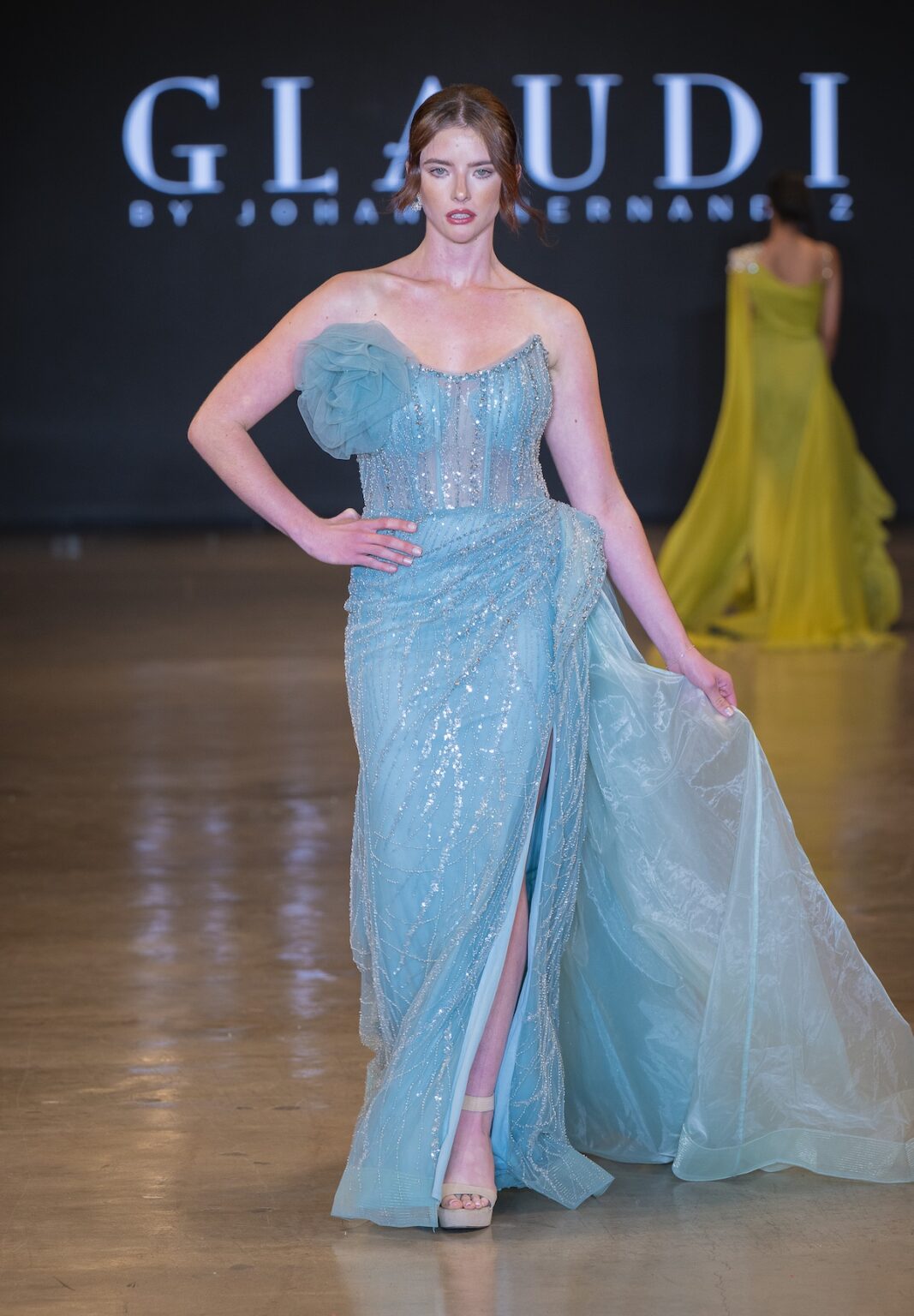 LOS ANGELES, CALIFORNIA - OCTOBER 16: A model walks the runway at the Glaudi show during Los Angeles Fashion Week Powered By Art Hearts Fashion at The New Mart on October 16, 2025 in Los Angeles, California. (Photo by Mark Gunter/Getty Images for Art Hearts Fashion)