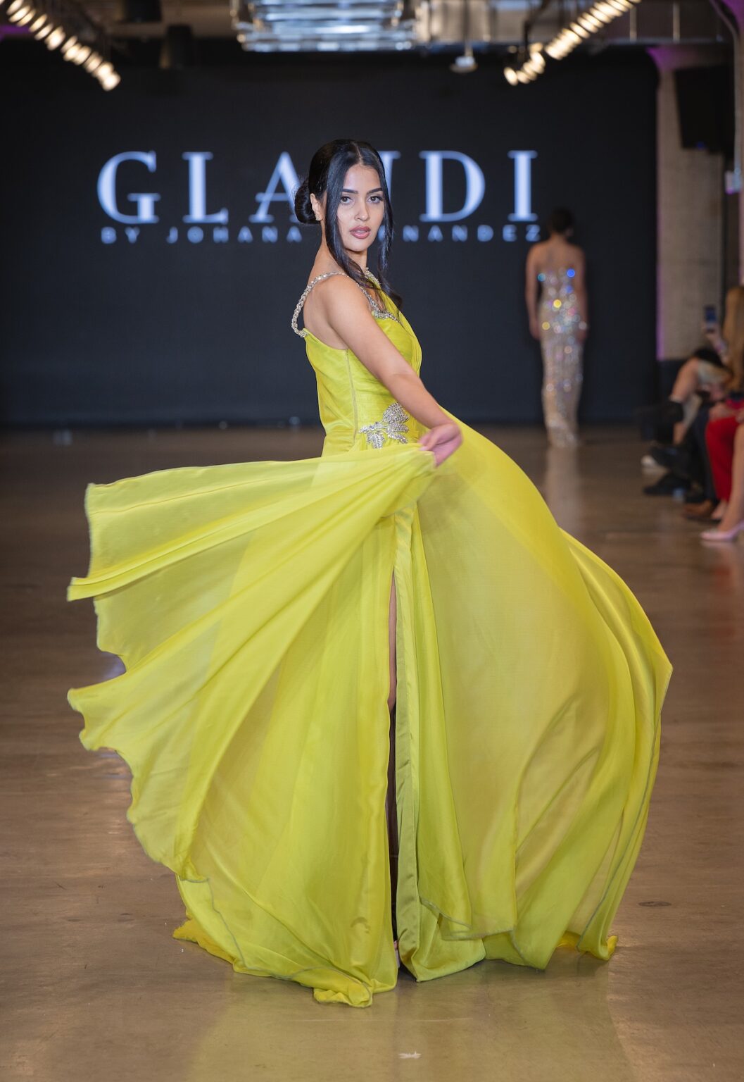 LOS ANGELES, CALIFORNIA - OCTOBER 16: A model walks the runway at the Glaudi show during Los Angeles Fashion Week Powered By Art Hearts Fashion at The New Mart on October 16, 2025 in Los Angeles, California. (Photo by Mark Gunter/Getty Images for Art Hearts Fashion)