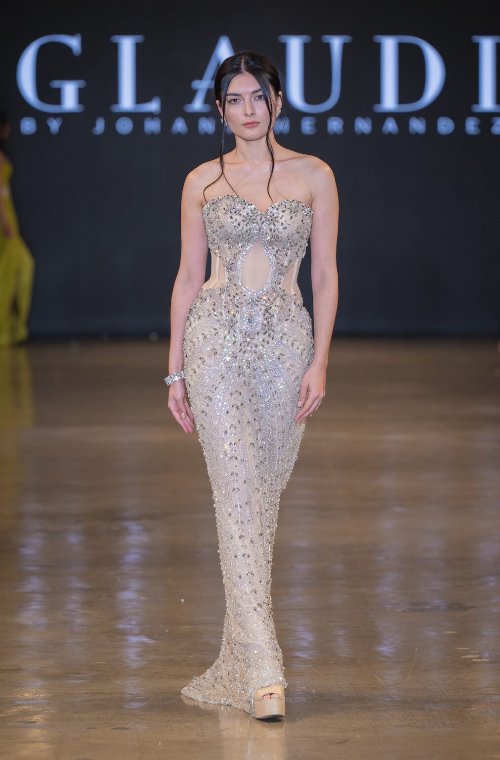 LOS ANGELES, CALIFORNIA - OCTOBER 16: A model walks the runway at the Glaudi show during Los Angeles Fashion Week Powered By Art Hearts Fashion at The New Mart on October 16, 2025 in Los Angeles, California. (Photo by Mark Gunter/Getty Images for Art Hearts Fashion)