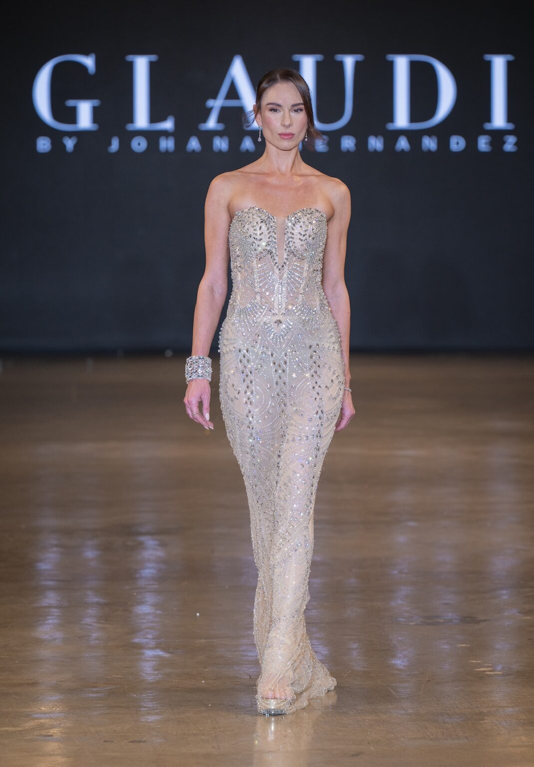 LOS ANGELES, CALIFORNIA - OCTOBER 16: A model walks the runway at the Glaudi show during Los Angeles Fashion Week Powered By Art Hearts Fashion at The New Mart on October 16, 2025 in Los Angeles, California. (Photo by Mark Gunter/Getty Images for Art Hearts Fashion)