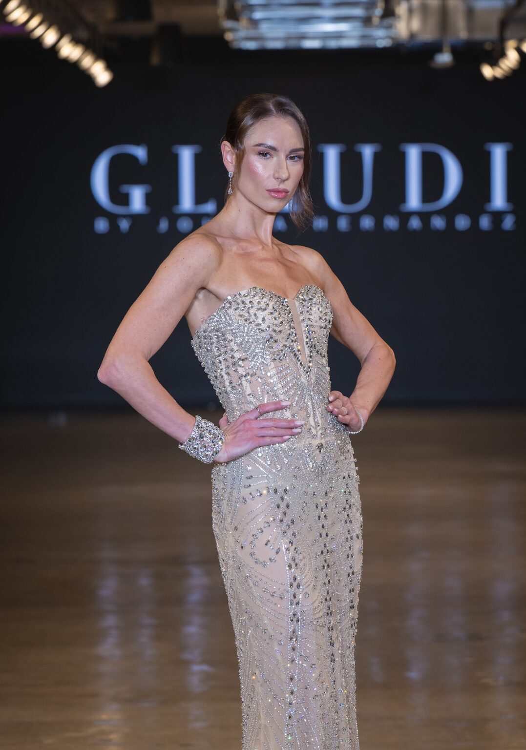LOS ANGELES, CALIFORNIA - OCTOBER 16: A model walks the runway at the Glaudi show during Los Angeles Fashion Week Powered By Art Hearts Fashion at The New Mart on October 16, 2025 in Los Angeles, California. (Photo by Mark Gunter/Getty Images for Art Hearts Fashion)