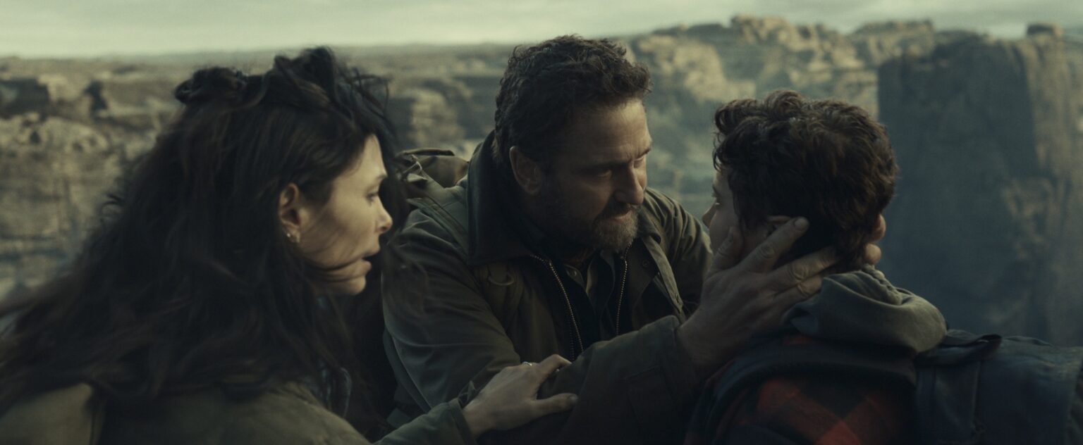 Morena Baccarin as Allison Garrity, Gerard Butler as John Garrity and Roman Griffin Davis as Nathan Garrity in Greenland 2: Migration. Photo Credit: Courtesy of Lionsgate