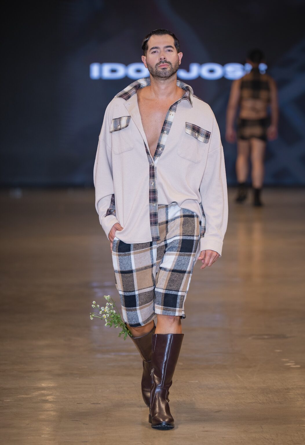 LOS ANGELES, CALIFORNIA - OCTOBER 16: A model walks the runway at the Idol Jose show during Los Angeles Fashion Week Powered By Art Hearts Fashion at The New Mart on October 16, 2025 in Los Angeles, California. (Photo by Mark Gunter/Getty Images for Art Hearts Fashion)