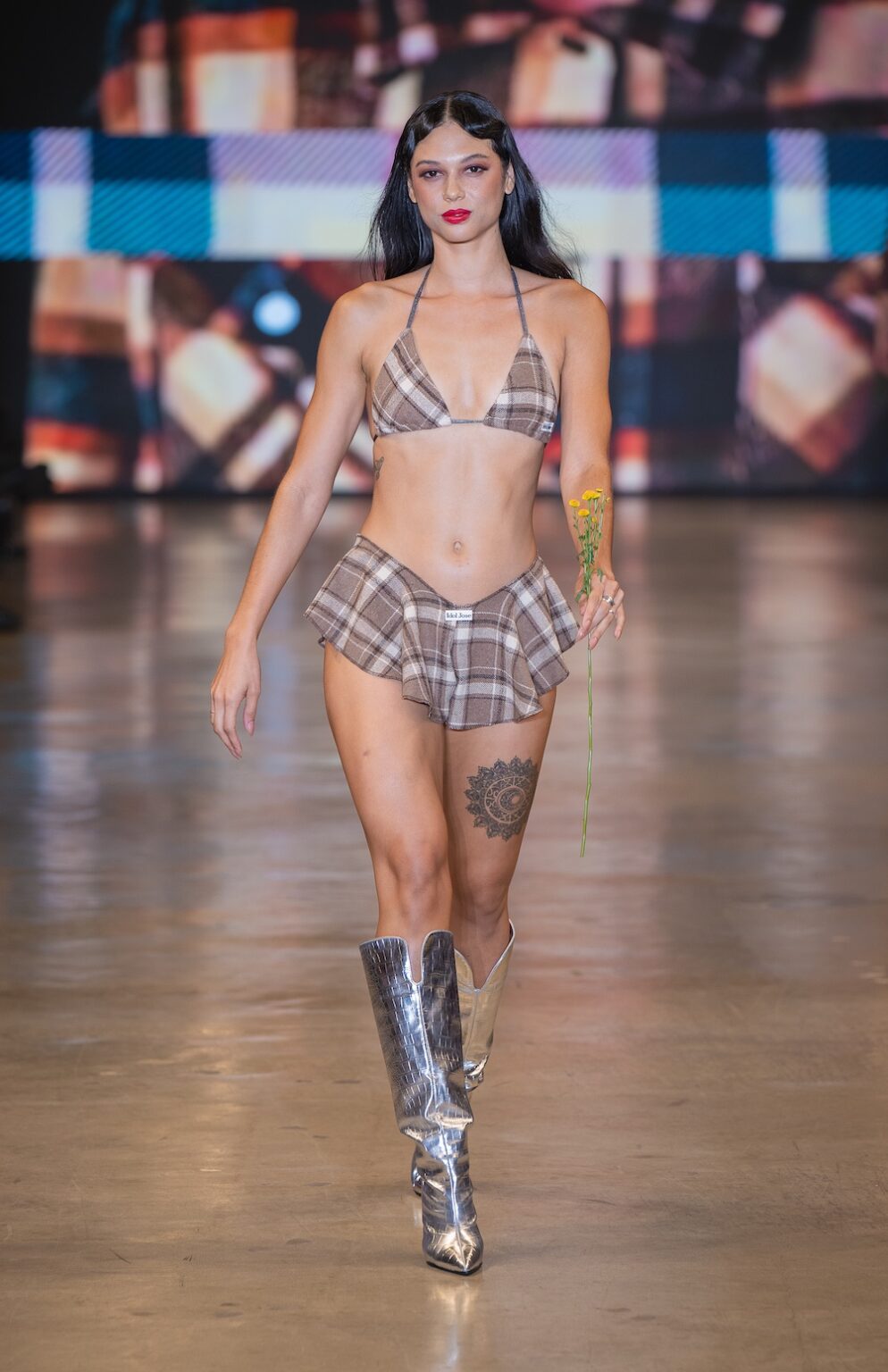 LOS ANGELES, CALIFORNIA - OCTOBER 16: A model walks the runway at the Idol Jose show during Los Angeles Fashion Week Powered By Art Hearts Fashion at The New Mart on October 16, 2025 in Los Angeles, California. (Photo by Mark Gunter/Getty Images for Art Hearts Fashion)
