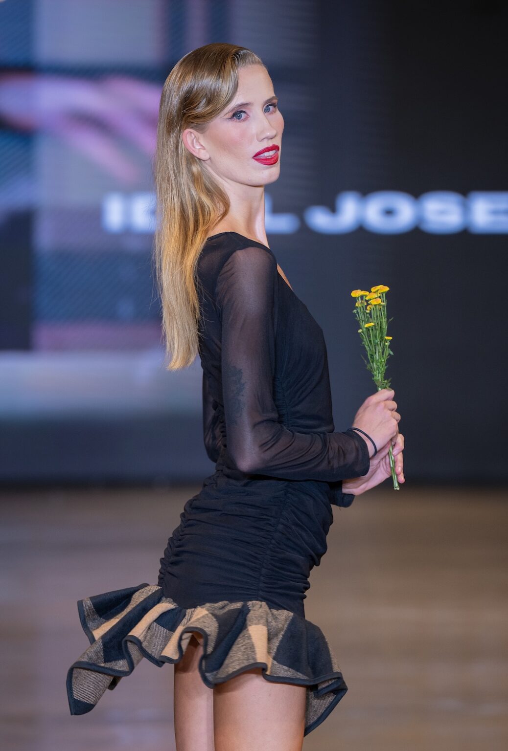 LOS ANGELES, CALIFORNIA - OCTOBER 16: A model walks the runway at the Idol Jose show during Los Angeles Fashion Week Powered By Art Hearts Fashion at The New Mart on October 16, 2025 in Los Angeles, California. (Photo by Mark Gunter/Getty Images for Art Hearts Fashion)
