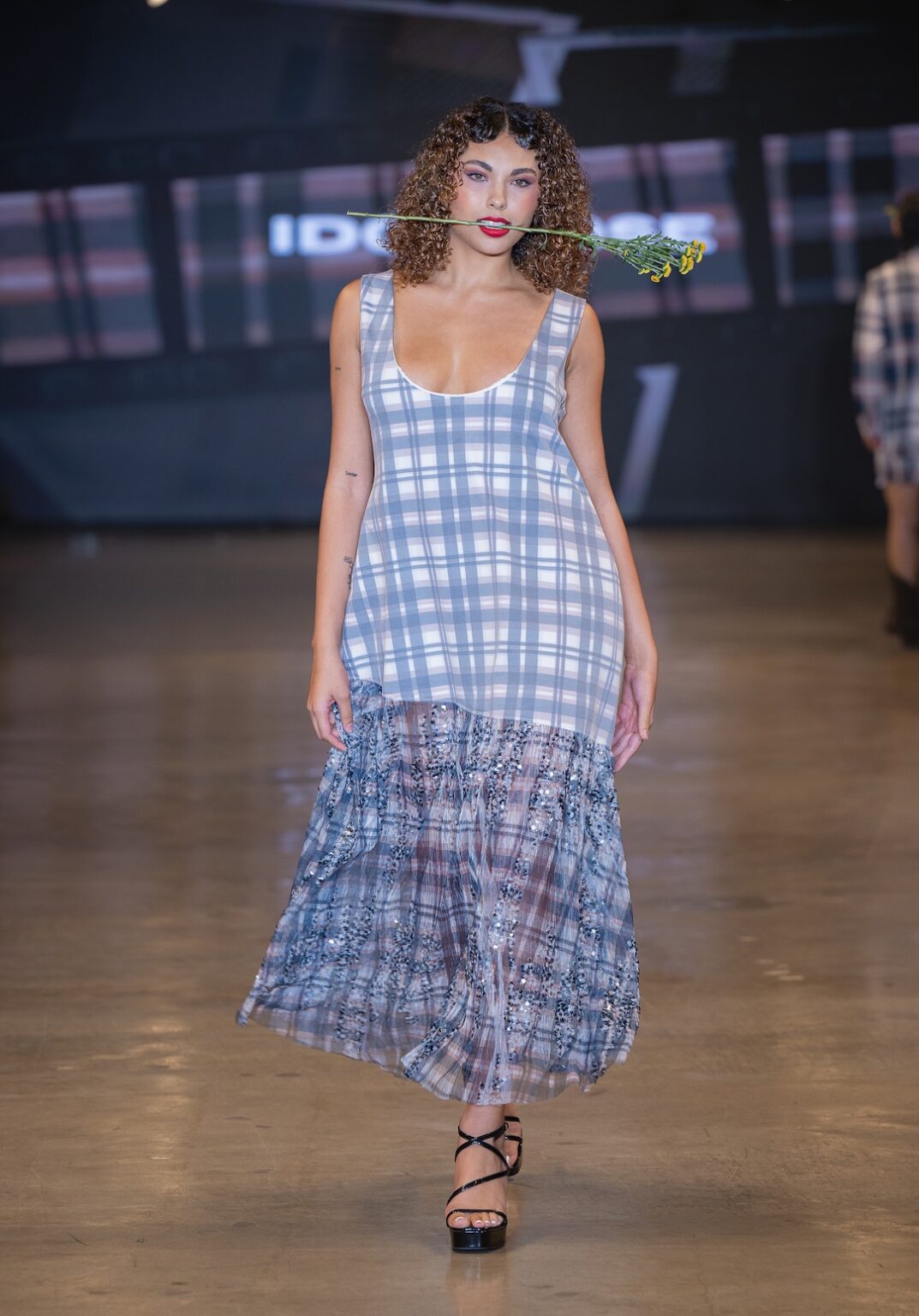 LOS ANGELES, CALIFORNIA - OCTOBER 16: A model walks the runway at the Idol Jose show during Los Angeles Fashion Week Powered By Art Hearts Fashion at The New Mart on October 16, 2025 in Los Angeles, California. (Photo by Mark Gunter/Getty Images for Art Hearts Fashion)