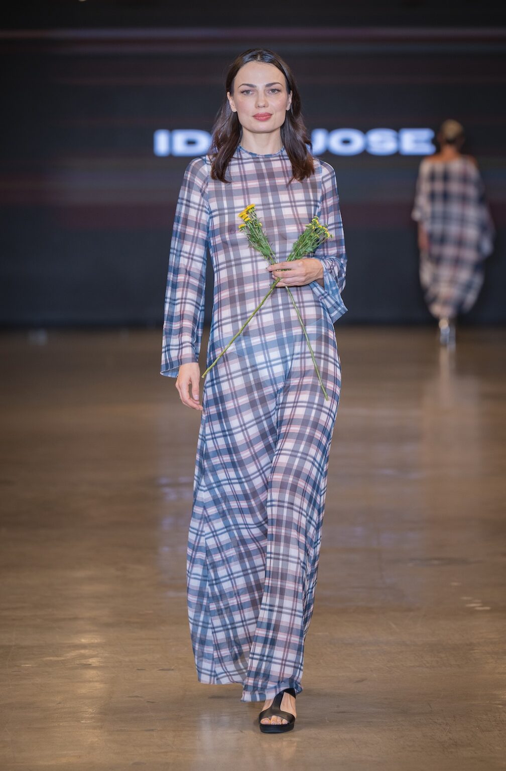 LOS ANGELES, CALIFORNIA - OCTOBER 16: A model walks the runway at the Idol Jose show during Los Angeles Fashion Week Powered By Art Hearts Fashion at The New Mart on October 16, 2025 in Los Angeles, California. (Photo by Mark Gunter/Getty Images for Art Hearts Fashion)