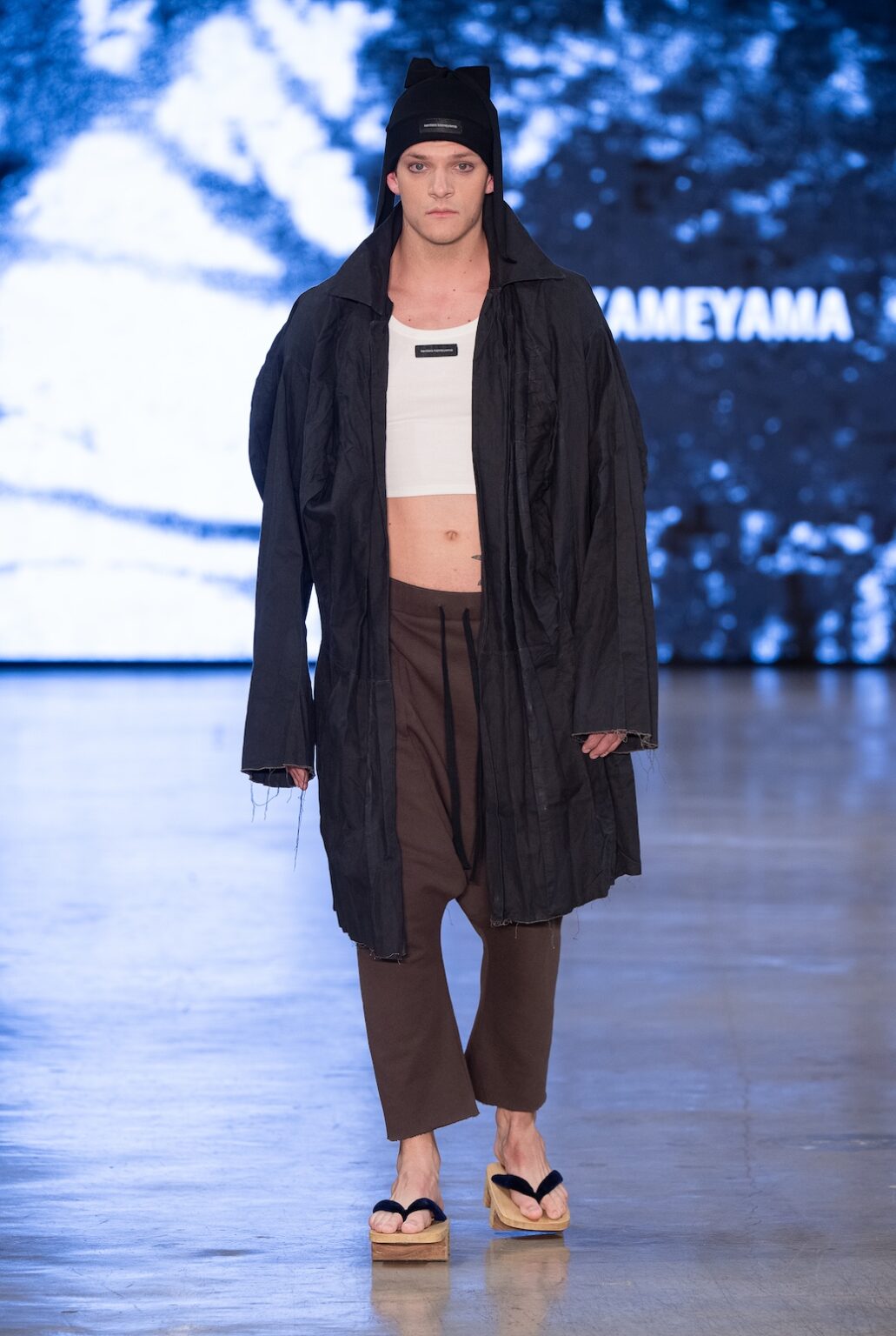 LOS ANGELES, CALIFORNIA - OCTOBER 17: A model walks the runway at the Kentaro Kameyama show during Los Angeles Fashion Week Powered By Art Hearts Fashion at The New Mart on October 17, 2025 in Los Angeles, California. (Photo by Mark Gunter/Getty Images for Art Hearts Fashion)