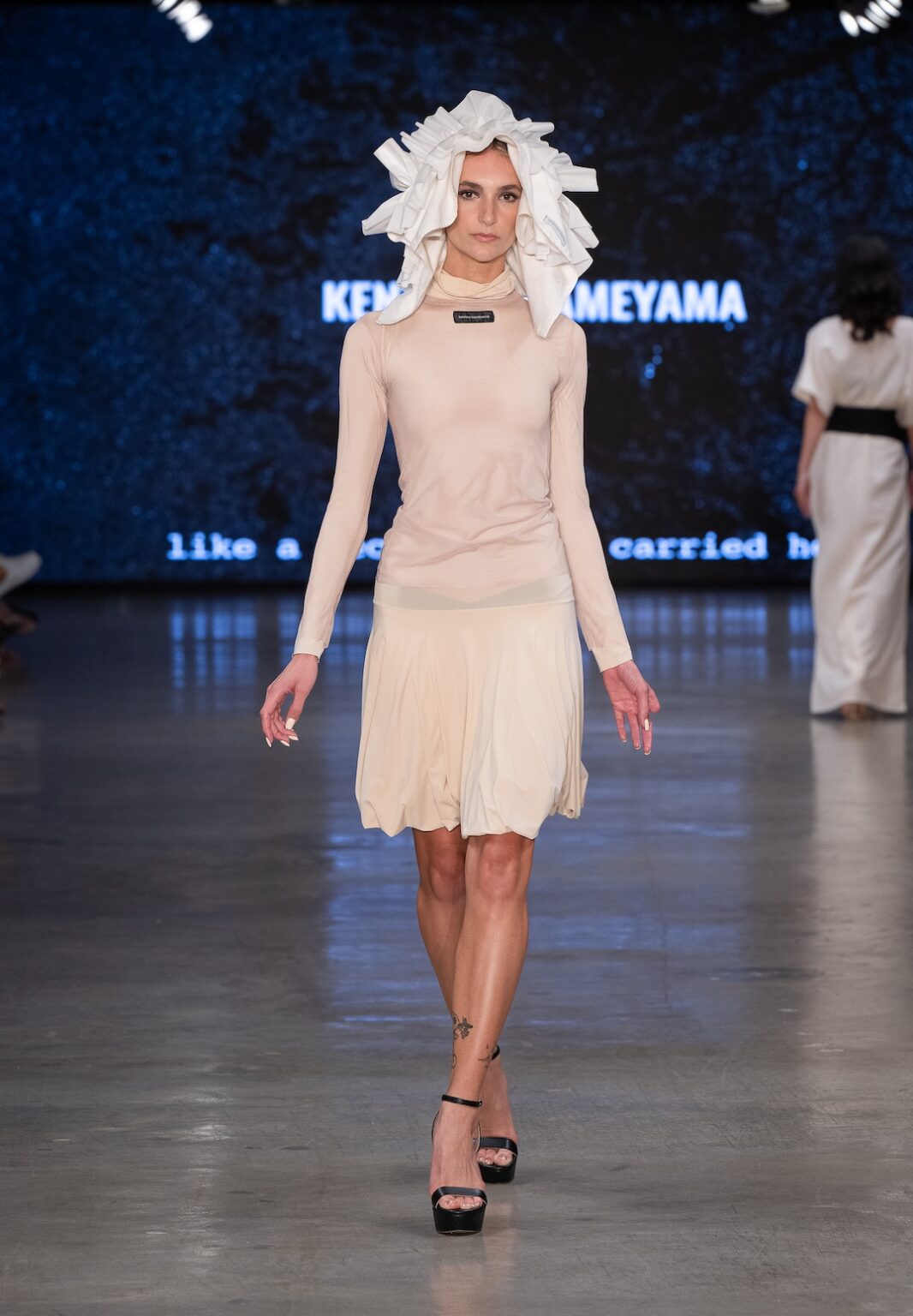 LOS ANGELES, CALIFORNIA - OCTOBER 17: A model walks the runway at the Kentaro Kameyama show during Los Angeles Fashion Week Powered By Art Hearts Fashion at The New Mart on October 17, 2025 in Los Angeles, California. (Photo by Mark Gunter/Getty Images for Art Hearts Fashion)