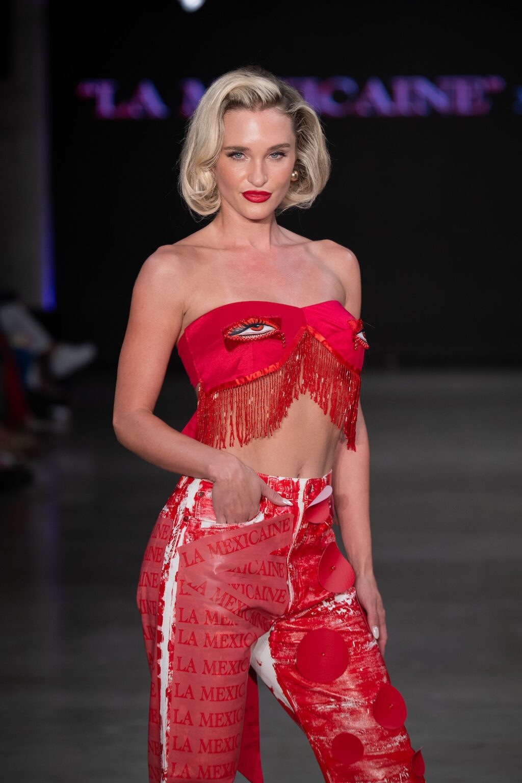 LOS ANGELES, CALIFORNIA - OCTOBER 17: A model walks the runway at the Amara show during Los Angeles Fashion Week Powered By Art Hearts Fashion at The New Mart on October 17, 2025 in Los Angeles, California. (Photo by Mark Gunter/Getty Images for Art Hearts Fashion)
