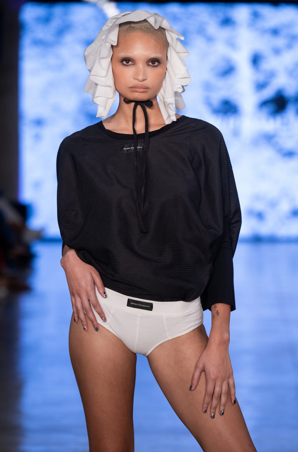 LOS ANGELES, CALIFORNIA - OCTOBER 17: A model walks the runway at the Kentaro Kameyama show during Los Angeles Fashion Week Powered By Art Hearts Fashion at The New Mart on October 17, 2025 in Los Angeles, California. (Photo by Mark Gunter/Getty Images for Art Hearts Fashion)