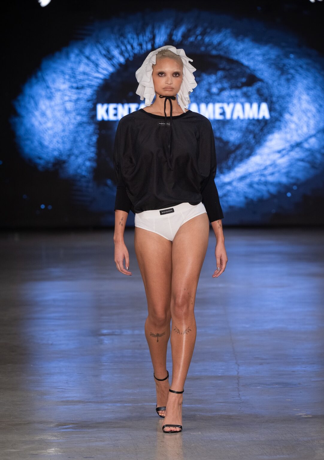 LOS ANGELES, CALIFORNIA - OCTOBER 17: A model walks the runway at the Kentaro Kameyama show during Los Angeles Fashion Week Powered By Art Hearts Fashion at The New Mart on October 17, 2025 in Los Angeles, California. (Photo by Mark Gunter/Getty Images for Art Hearts Fashion)
