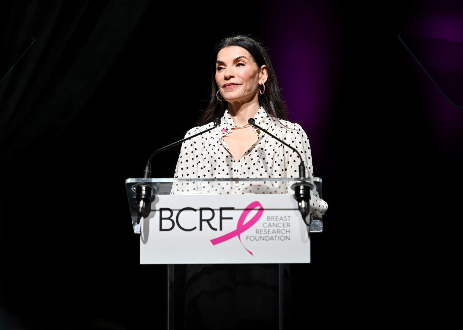 NEW YORK, NEW YORK - OCTOBER 30: Julianna Margulies speaks onstage at the Breast Cancer Research Foundation New York Symposium & Awards Luncheon at New York Hilton Midtown on October 30, 2025 in New York City. (Photo by Noam Galai/Getty Images for Breast Cancer Research Foundation) PHOTO BY NOAM GALAI