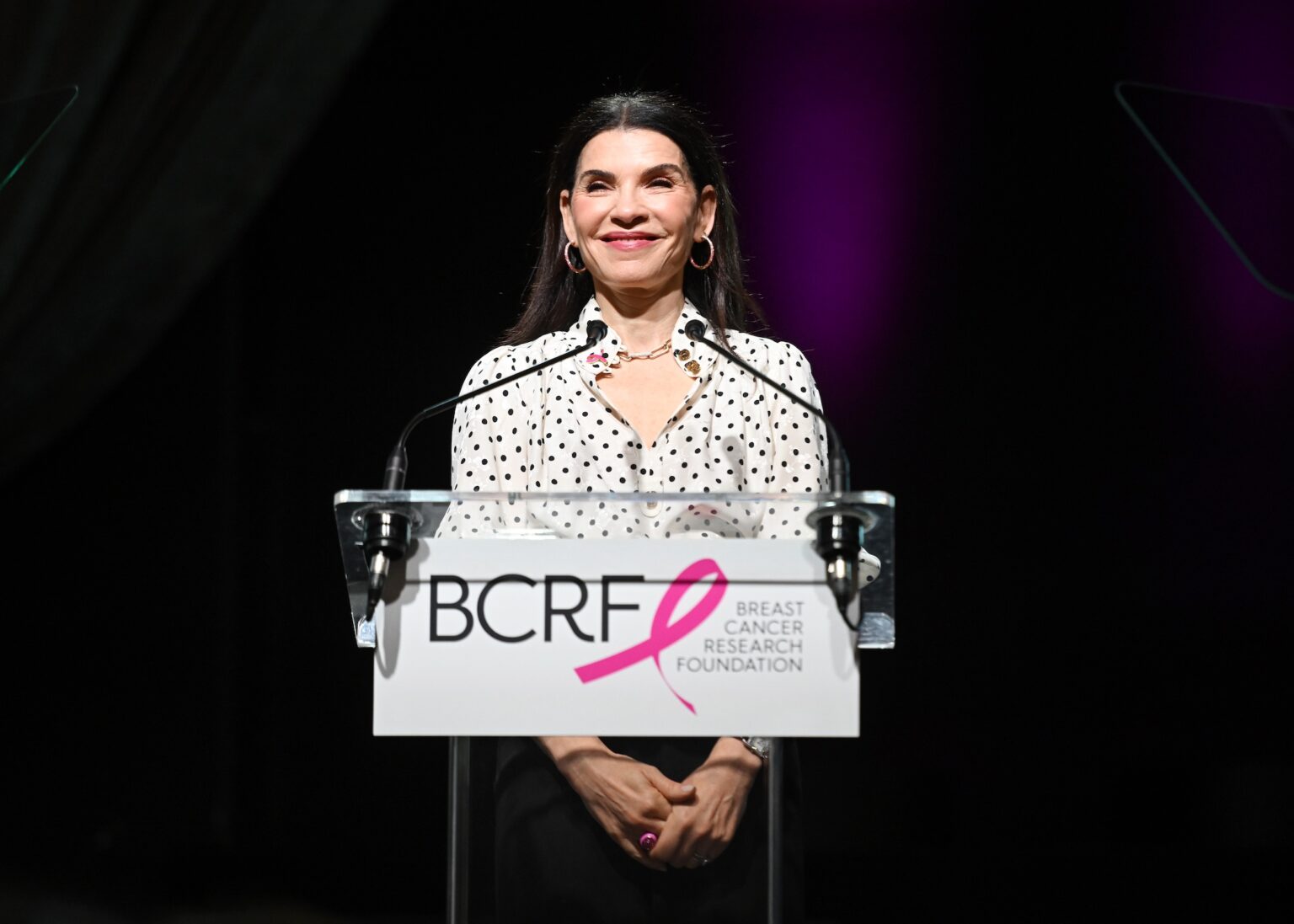 NEW YORK, NEW YORK - OCTOBER 30: Julianna Margulies speaks onstage at the Breast Cancer Research Foundation New York Symposium & Awards Luncheon at New York Hilton Midtown on October 30, 2025 in New York City. (Photo by Noam Galai/Getty Images for Breast Cancer Research Foundation) PHOTO BY NOAM GALAI