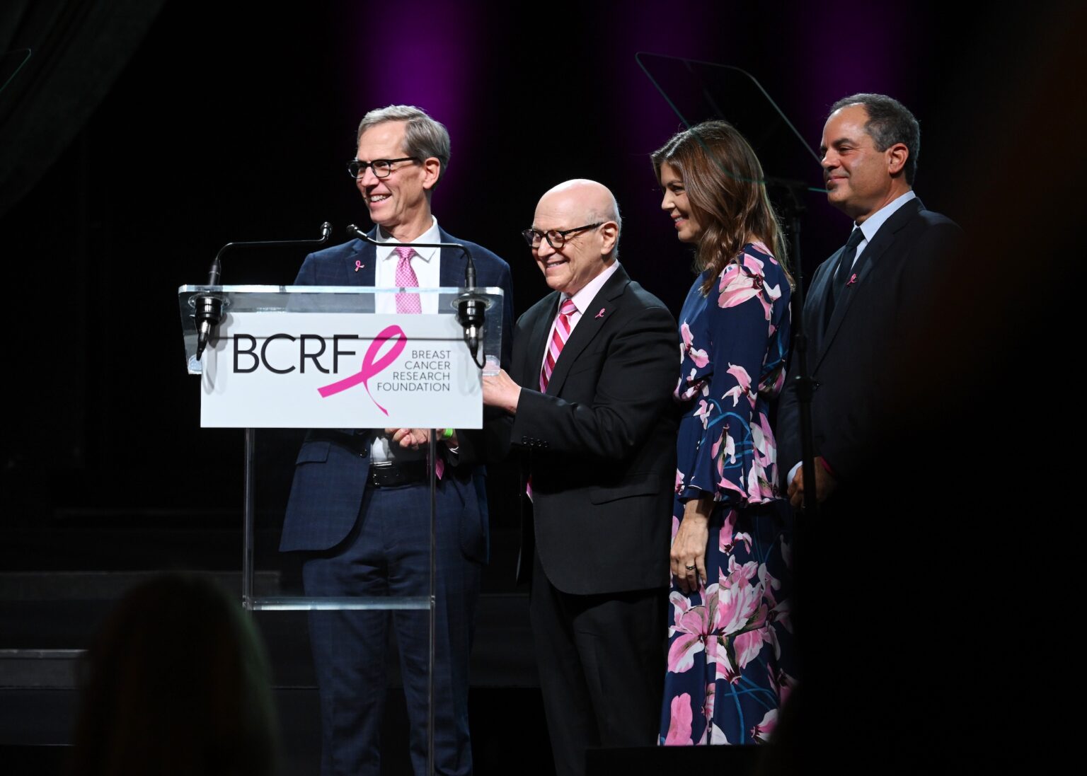 NEW YORK, NEW YORK - OCTOBER 30: (L-R) Robert H. Vonderheide, Dr. Larry Norton, Wendy Rose and Andy Rose speak onstage at the Breast Cancer Research Foundation New York Symposium & Awards Luncheon at New York Hilton Midtown on October 30, 2025 in New York City. (Photo by Bryan Bedder/Getty Images for Breast Cancer Research Foundation) PHOTO BY NOAM GALAI