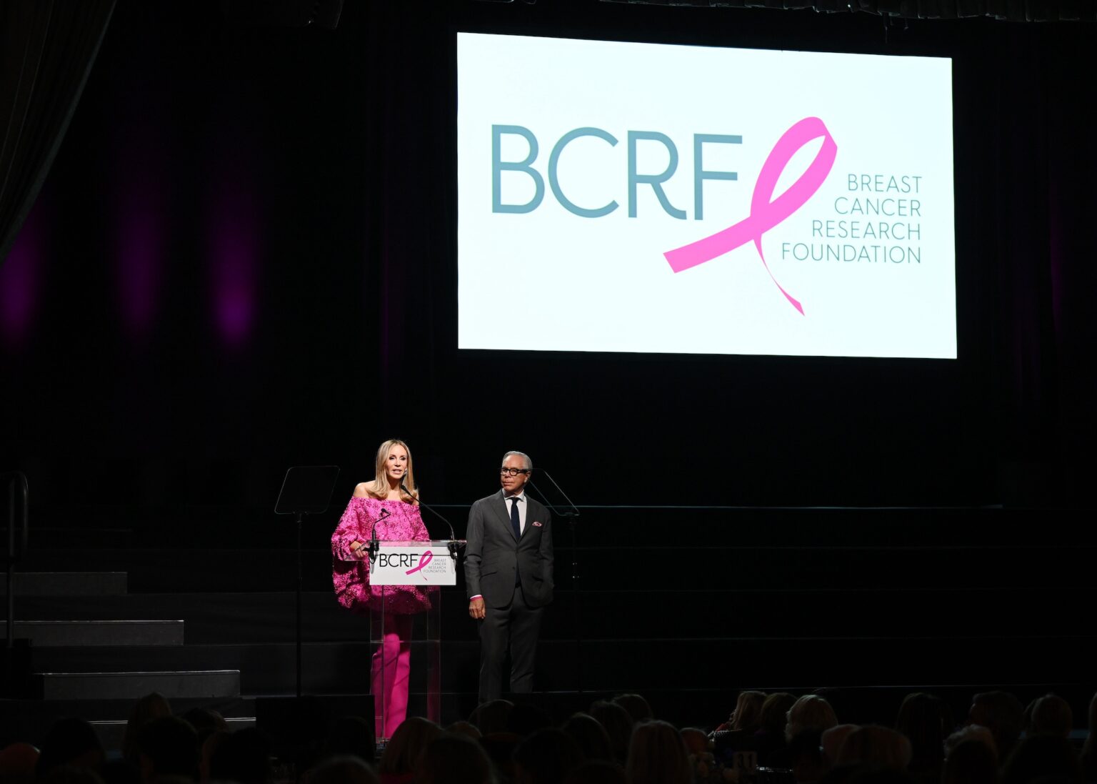 NEW YORK, NEW YORK - OCTOBER 30: (L-R) Dee Ocleppo Hilfiger and Tommy Hilfiger speak onstage at the Breast Cancer Research Foundation New York Symposium & Awards Luncheon at New York Hilton Midtown on October 30, 2025 in New York City. (Photo by Bryan Bedder/Getty Images for Breast Cancer Research Foundation)