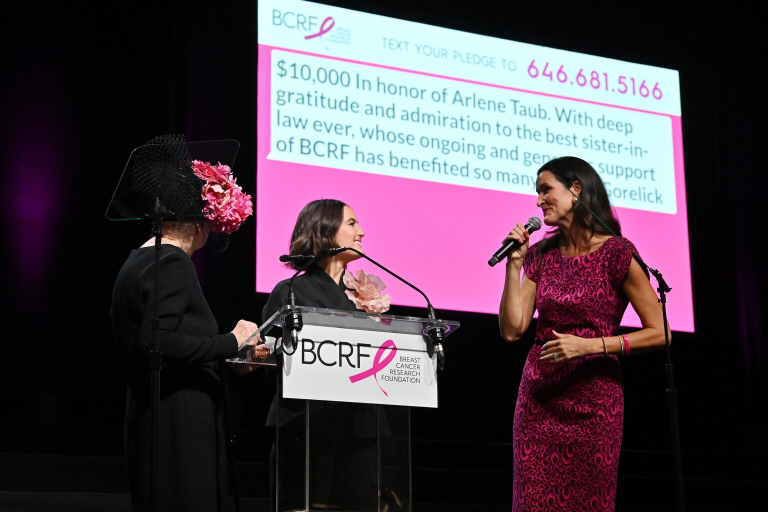 NEW YORK, NEW YORK - OCTOBER 30: (L-R) Roslyn Goldstein, Eliana Lauder and Lydia Fenet speak onstage at the Breast Cancer Research Foundation New York Symposium & Awards Luncheon at New York Hilton Midtown on October 30, 2025 in New York City. (Photo by Bryan Bedder/Getty Images for Breast Cancer Research Foundation)