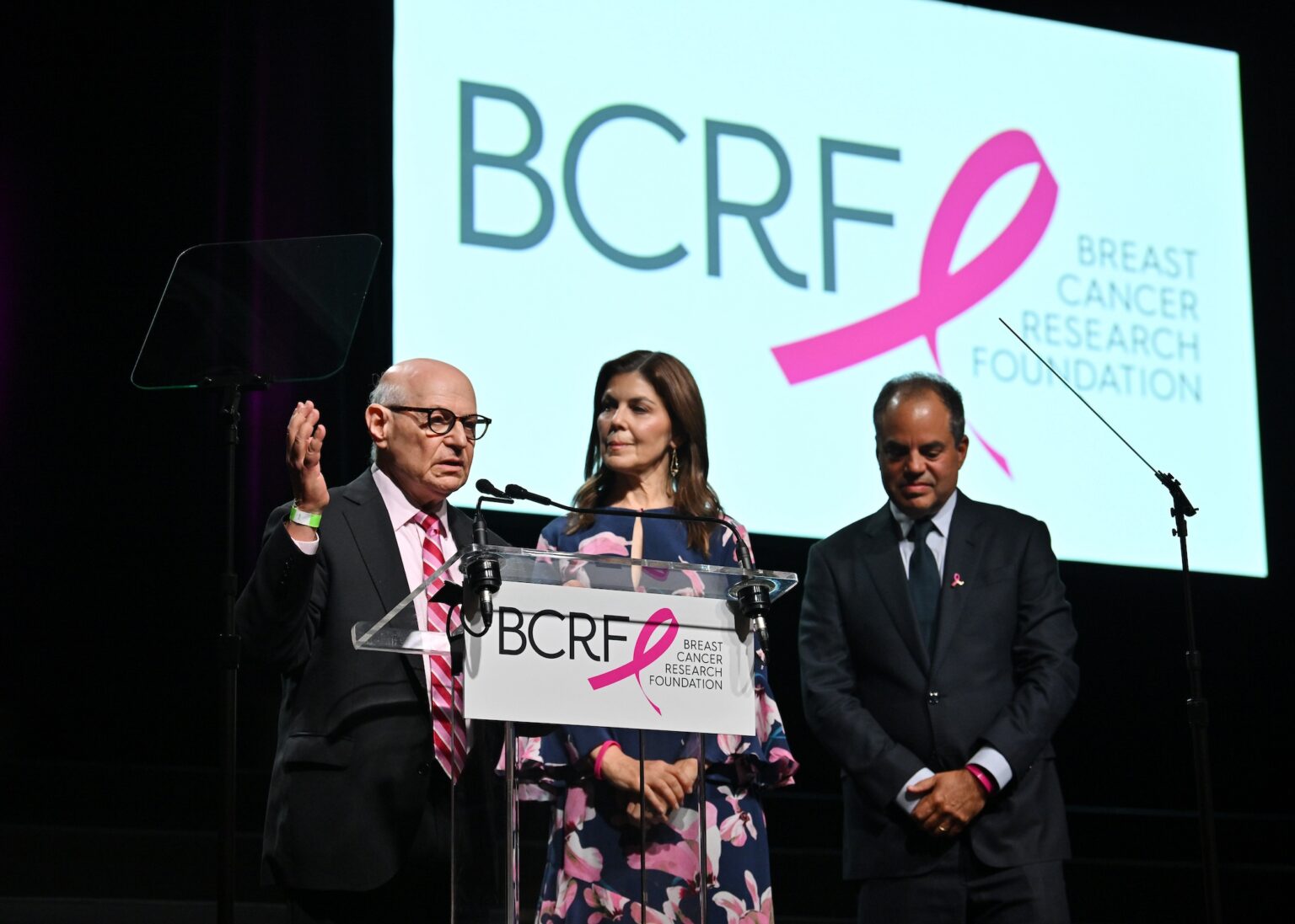 NEW YORK, NEW YORK - OCTOBER 30: (L-R) Dr. Larry Norton, Wendy Rose and Andy Rose speak onstage at the Breast Cancer Research Foundation New York Symposium & Awards Luncheon at New York Hilton Midtown on October 30, 2025 in New York City. (Photo by Bryan Bedder/Getty Images for Breast Cancer Research Foundation)