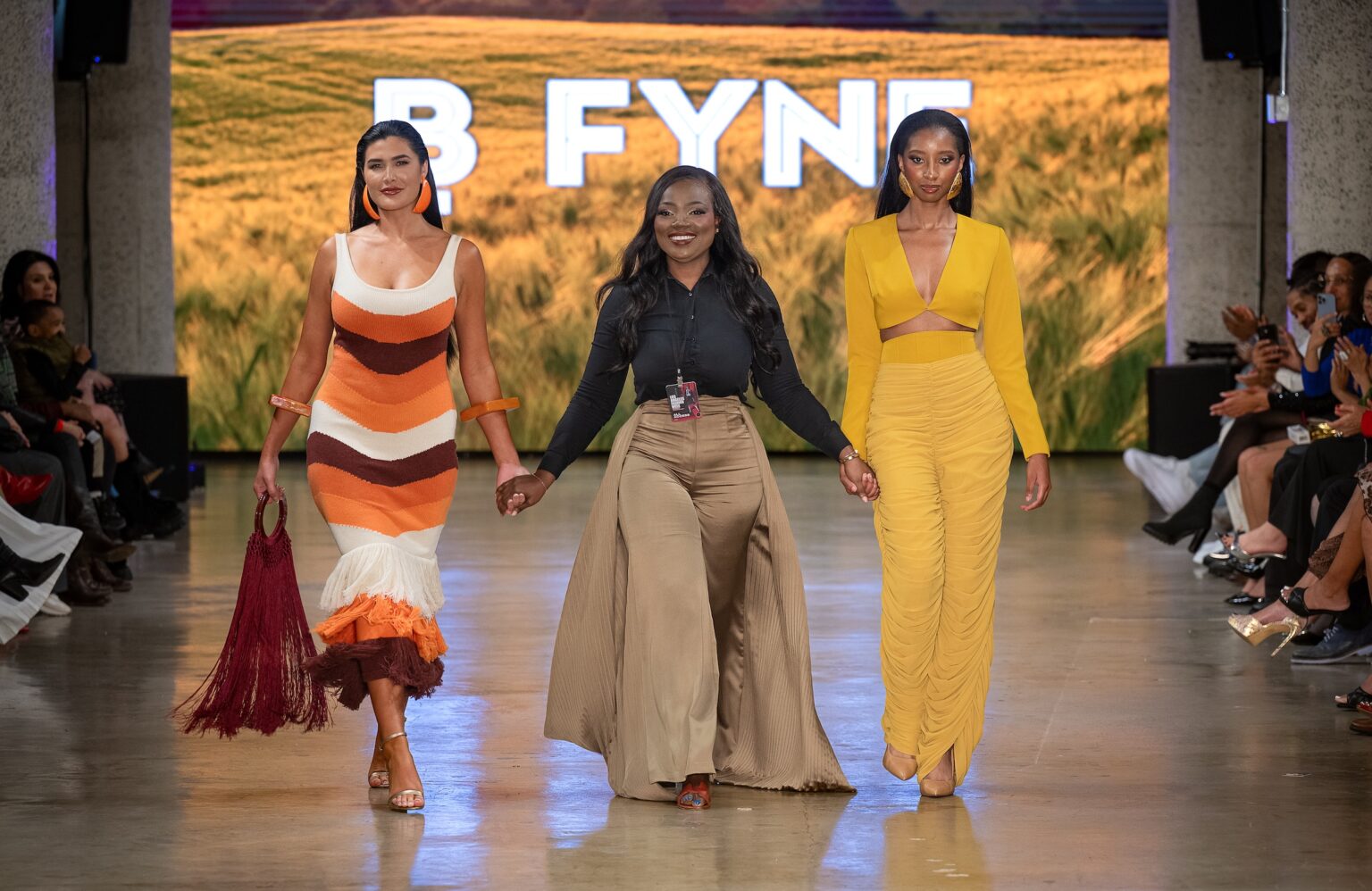 LOS ANGELES, CALIFORNIA - OCTOBER 18: Designer Buki Ade and models walk the runway at the BFYNE show during Los Angeles Fashion Week Powered By Art Hearts Fashion at The New Mart on October 18, 2025 in Los Angeles, California. (Photo by Mark Gunter/Getty Images for Art Hearts Fashion)