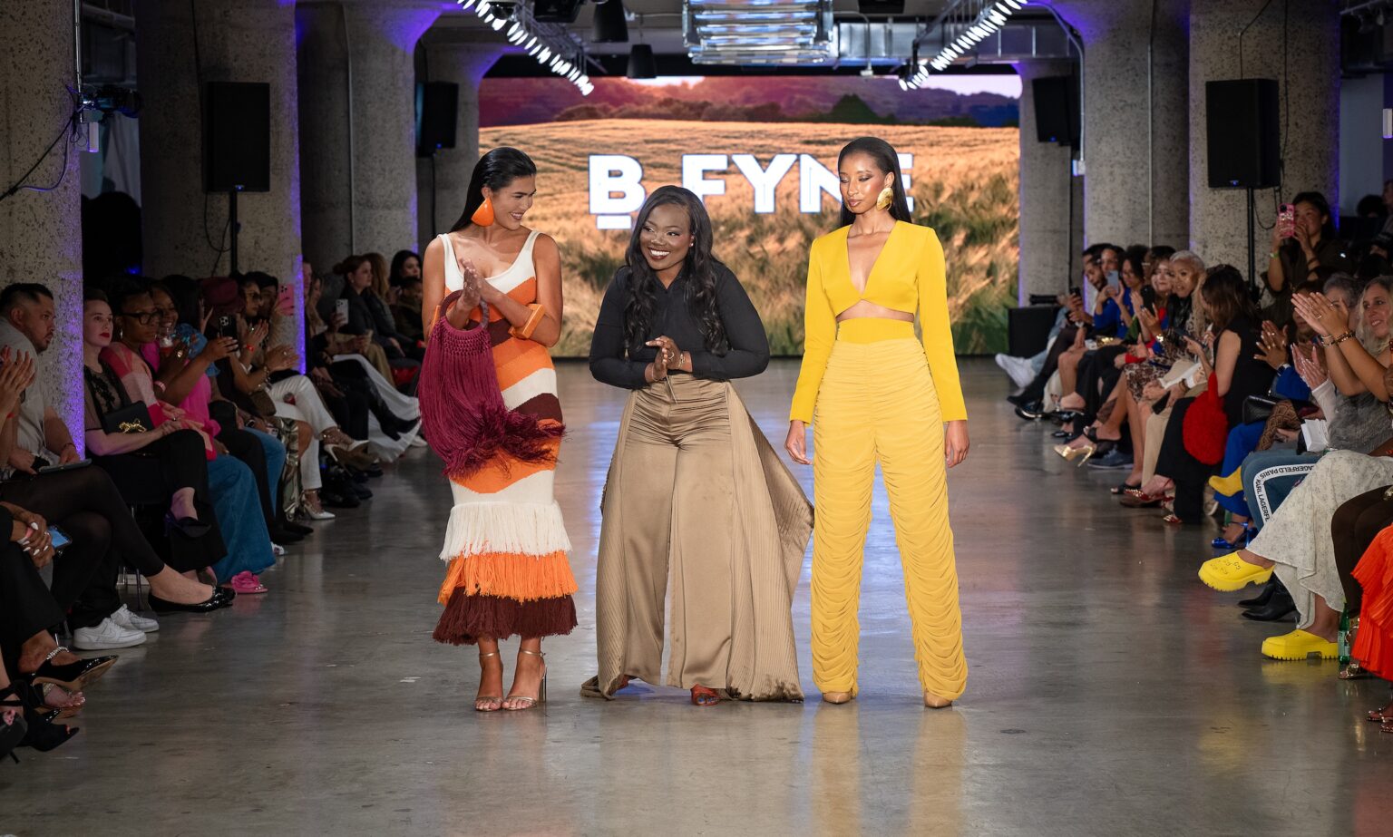 LOS ANGELES, CALIFORNIA - OCTOBER 18: Designer Buki Ade and models walk the runway at the BFYNE show during Los Angeles Fashion Week Powered By Art Hearts Fashion at The New Mart on October 18, 2025 in Los Angeles, California. (Photo by Mark Gunter/Getty Images for Art Hearts Fashion)