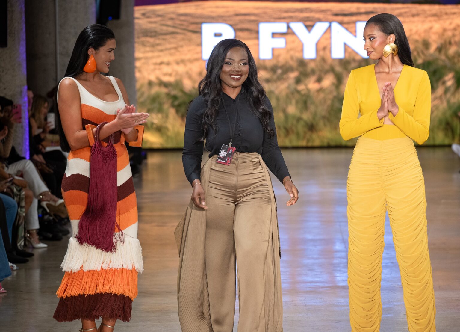 LOS ANGELES, CALIFORNIA - OCTOBER 18: Designer Buki Ade and models walk the runway at the BFYNE show during Los Angeles Fashion Week Powered By Art Hearts Fashion at The New Mart on October 18, 2025 in Los Angeles, California. (Photo by Mark Gunter/Getty Images for Art Hearts Fashion)