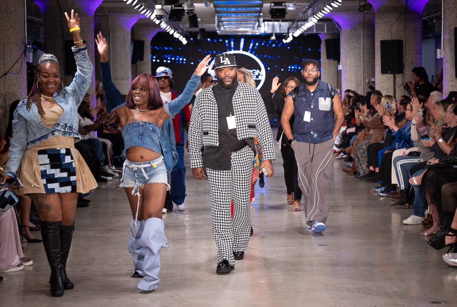 LOS ANGELES, CALIFORNIA - OCTOBER 18: Designer and models walk the runway at the Upcycle Denim & Sustainability Project 2025 show during Los Angeles Fashion Week Powered By Art Hearts Fashion at The New Mart on October 18, 2025 in Los Angeles, California. (Photo by Mark Gunter/Getty Images for Art Hearts Fashion)