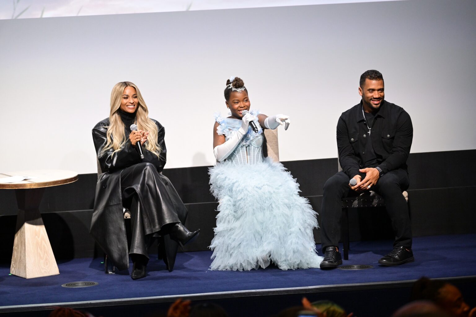 NEW YORK, NEW YORK - NOVEMBER 05: (L-R) Ciara, Naya Desir-Johnson and Russell Wilson speak onstage during the NY special screening of Amazon MGM Studios "Sarah's Oil" at The Whitby Hotel on November 05, 2025 in New York City. (Photo by Valerie Terranova/Getty Images for Amazon MGM Studios)